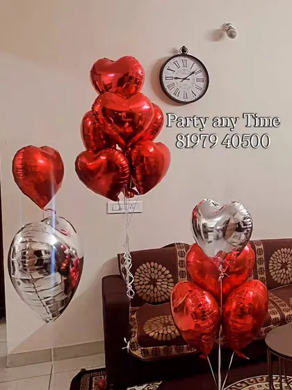Another shot of the heart-shaped balloon bouquets for an anniversary.