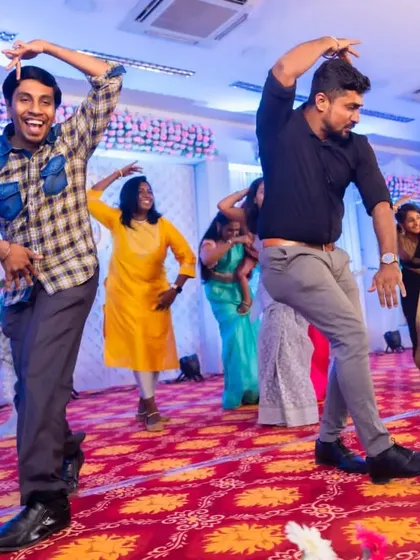 The boys showing off their best moves on the dance floor. We create a high-energy environment where everyone feels free to bust a move.