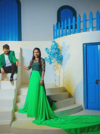 This couple chose a bright green trail gown and a matching green blazer for a bold, monochromatic look. It's a great way to make a statement in your pre-wedding photos.