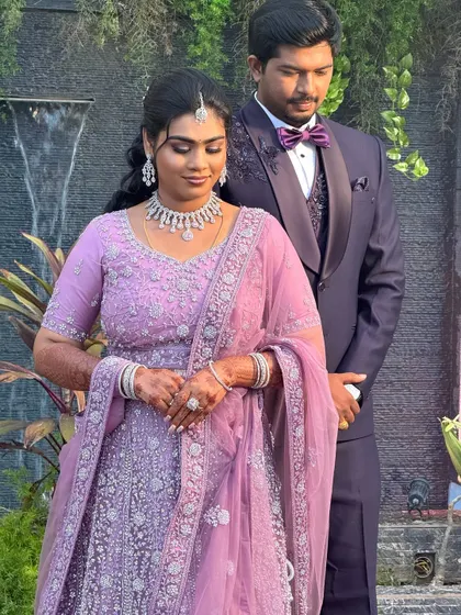 Aparna on her reception day, looking stunning in a lavender lehenga. The makeup is soft and romantic to match her outfit.