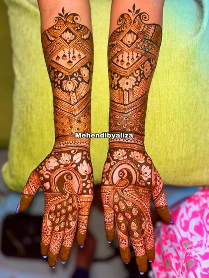 A gorgeous semi-bridal design featuring bold peacocks and intricate geometric patterns. It's perfect for an engagement or for a bride who wants a slightly lighter look.