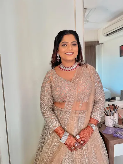 A happy bride ready to celebrate with her family and friends at her reception.