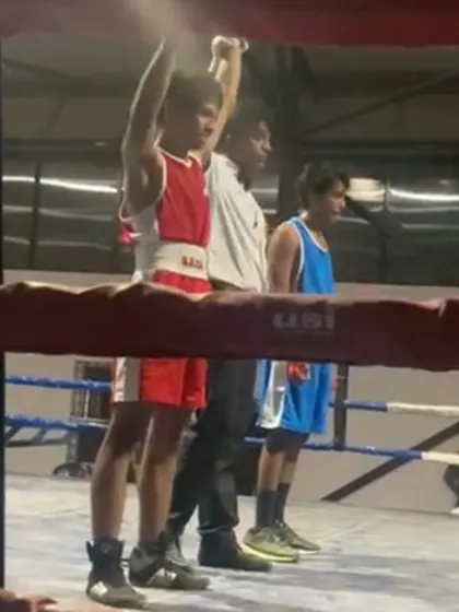 The moment of victory for our young boxer, Scott. Having his hand raised is a reward for the discipline and countless hours of training.