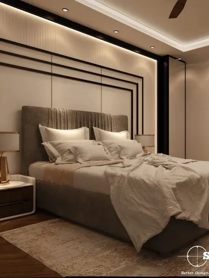 A side view of a master bedroom, showing the custom bedside table and the layered textures of the bedding and rug. The design focuses on creating a warm and inviting space with a neutral palette.