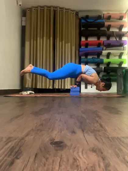 "The poses are my prayers." Holding Mayurasana on blocks to get a deeper lift. Using props helps in understanding the alignment and mechanics of a pose.