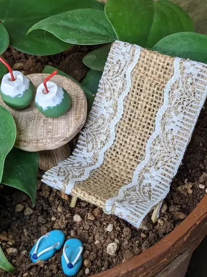 A close up of the handmade beach chair and tender coconuts. It's all about the small details.
