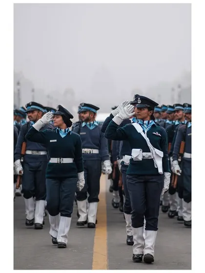 Female officers of the Indian Air Force salute with pride as they march during Republic Day rehearsals.