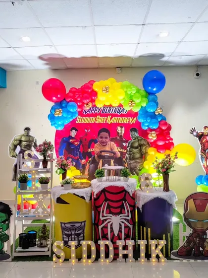 An action-packed Avengers and superheroes theme for a birthday party, featuring Hulk, Iron Man, and Superman.