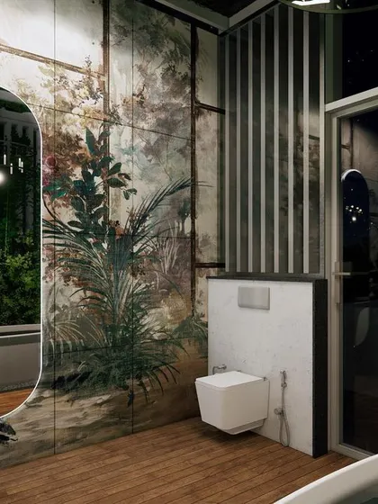 Another angle of the tropical bathroom, showing the freestanding tub and the reflection in the mirror. The design seamlessly blends the indoor space with the green foliage outside.