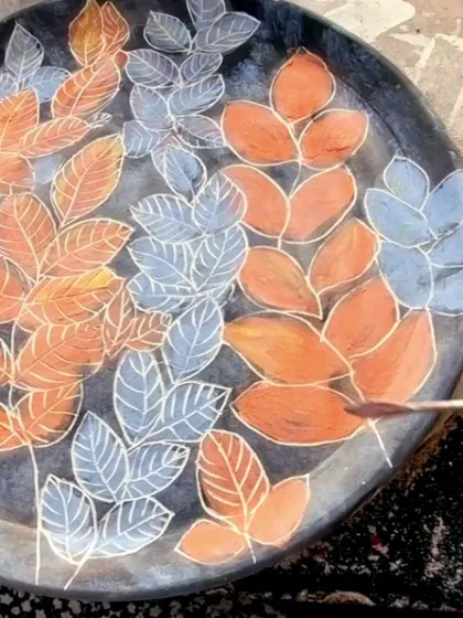 The sgraffito process in action. I am carefully carving the veins of the leaves, a delicate process that requires a steady hand.