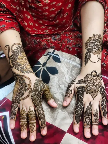 A beautiful design for the bride's sister, featuring bold leafy patterns and delicate floral touches.
