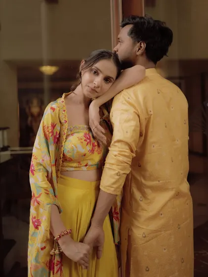 A tender and artistic portrait of a couple during their Haldi ceremony, sharing a quiet moment.