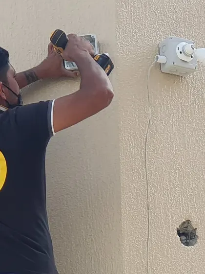 A hands-on shot of me installing a junction box for a new Tiandy camera. A solid foundation is important for a stable security camera.