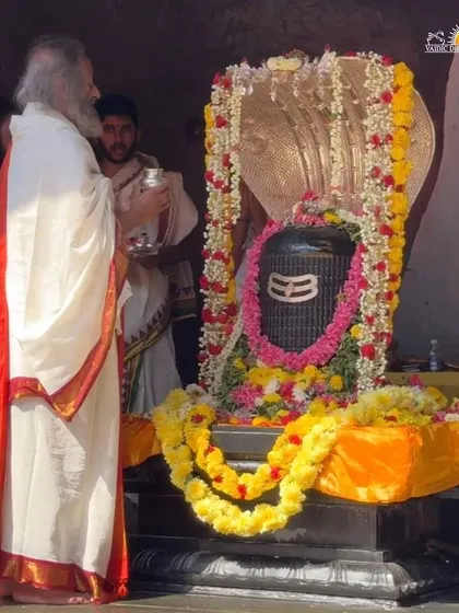 Performing the morning Shiva Puja on Maha Shivratri. The beautifully adorned Shiva Lingam is the center of our devotion, representing the formless, eternal consciousness.