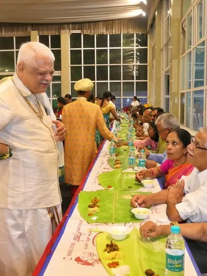 An event organizer or family elder overseeing the lunch service. I always work closely with my clients to ensure every detail is to their satisfaction.