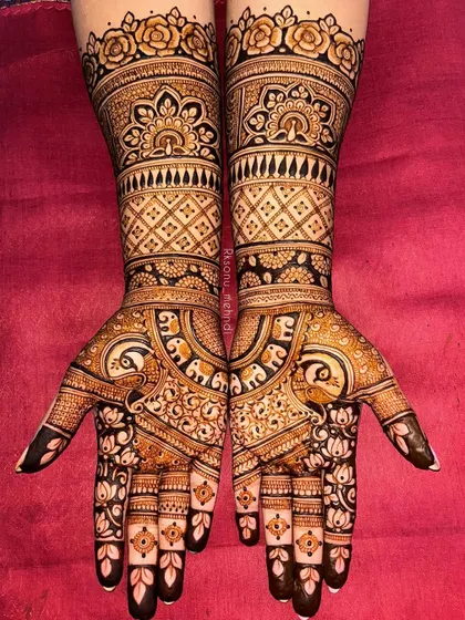 A beautiful ring ceremony design that combines all the classic elements: florals, peacocks, and elephants. The full-arm coverage makes a grand statement for this special occasion.