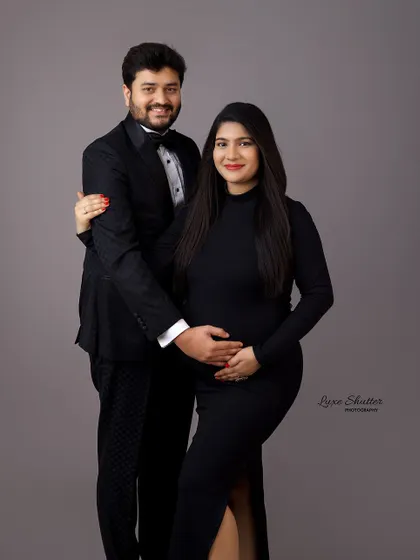 A classic, formal portrait of the happy couple. The tuxedo and elegant black dress make this a sophisticated and timeless image.