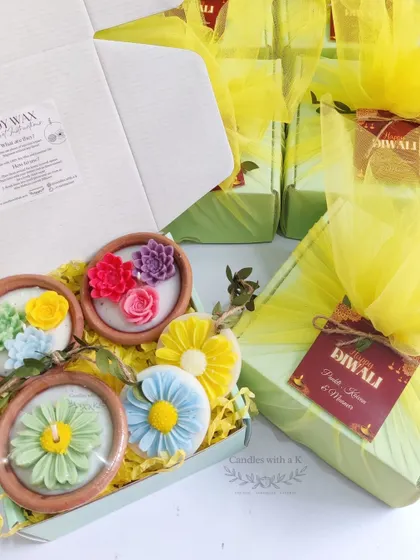 The complete large Diwali gift box, containing clay pot candles and wax sachets, beautifully packaged with a custom tag.