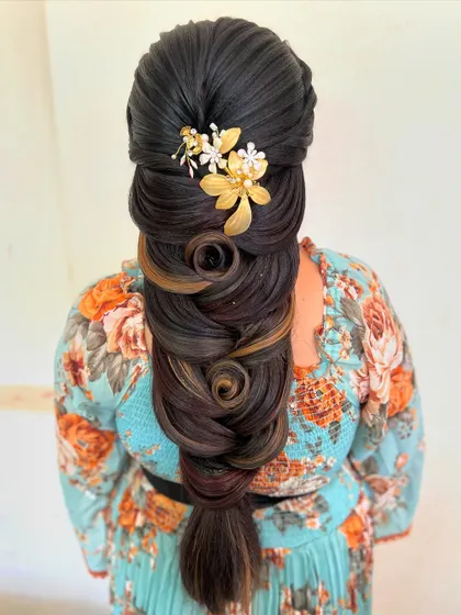 A closer view of the hair rose and swirl braid, showing the precision and creativity involved in this advanced styling technique.