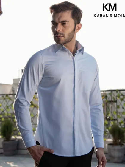 A full view of the light blue shirt, showcasing its tailored lines and breathable fabric. It's not loud, just unmistakably refined for your everyday sharp look.