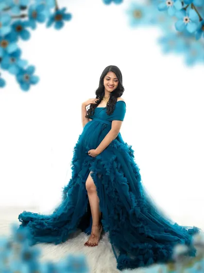 A bright and airy maternity portrait. The makeup is soft and natural, with a focus on enhancing her features for this beautiful, light-filled photo.
