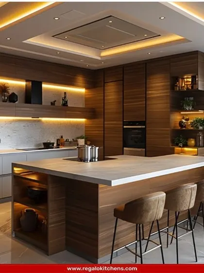 Warm and inviting, this island kitchen combines rich wood tones with a clean, solid-surface countertop. The integrated breakfast bar and open shelving make it a highly functional space for both cooking and socializing, perfect for family life.