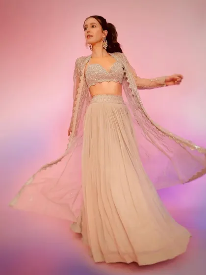 The full, flowing look of the Rishi and Soujit ensemble. The sheer jacket adds a layer of elegance and movement.