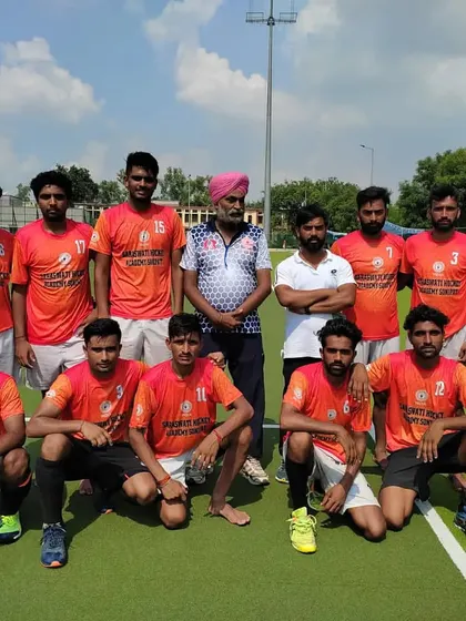 The Senior Men's team with their coaches. We focus on advanced skills and strategy to ensure they perform at the top level of men's hockey.