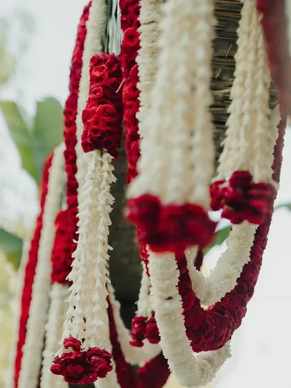 Hanging garlands of red and white flowers.