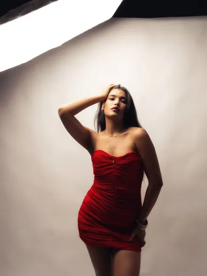 Another moment from the same studio session, capturing a classic pose. The visible lighting equipment in the frame gives clients a clear idea of the professional setup I use for indoor and fashion portfolio shoots.