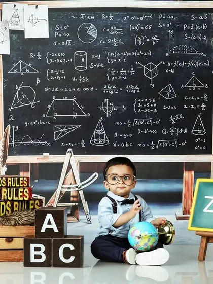 A future scholar in the making. This clever back-to-school theme with a chalkboard, globe, and ABC blocks is a fun and unique way to capture a milestone.