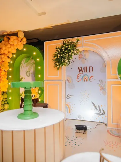 Another view of the 'Wild One' stage, showing the different display stands and the hot air balloon prop. The layout is designed to be visually balanced and interesting from all angles.