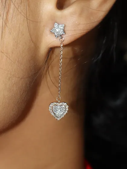 A clear, close-up shot of the star and heart droplet earring, showing the beautiful pave diamond details.