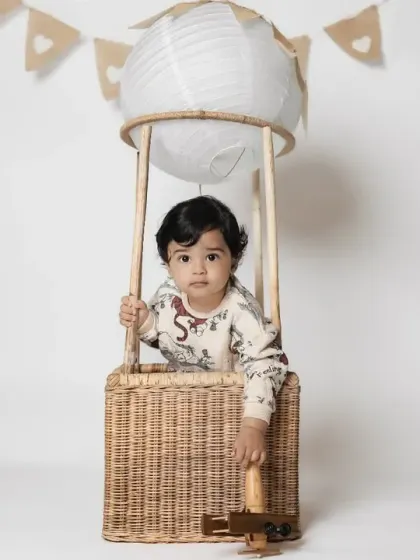 A simple and classic hot air balloon setup against a clean white background.