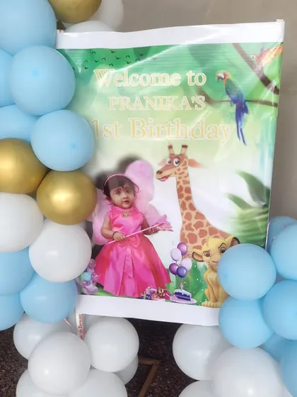 A welcome sign for a first birthday featuring a mix of fairy and jungle elements.