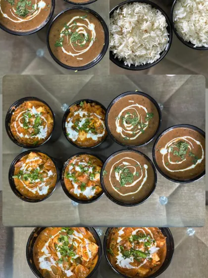 A top-down view of a bulk order for Dal Makhni and Kadai Paneer. This is perfect for parties where you want to serve food in separate containers.