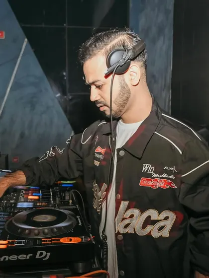 A focused shot of me at the decks at Shimmers Raipur, getting ready to kick off 2024.