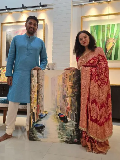 Our esteemed art collectors with a beautiful Venice painting by artist Moin that they purchased during our Affordable Art Exhibition. We love helping clients find art that reminds them of special places.