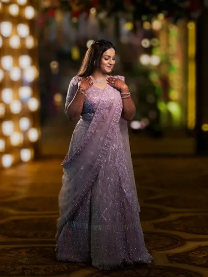 A candid and graceful portrait of the bride. The soft lighting and her gentle expression create a timeless and beautiful wedding photo.