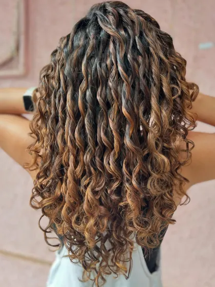 Caramel kissed curlylocks. A beautiful non-bleach color to add warmth and dimension to these stunning curls. (No filter)