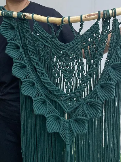 Here is a closer look at the 'Heer' tapestry, held up so you can see its full size and shape. The deep green color is so rich and looks amazing against a light-colored wall.