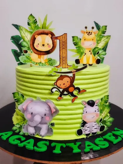 Welcome to the jungle! A butterscotch cake for Agastyasen's first birthday, decorated with cute edible prints of his favorite safari animals.