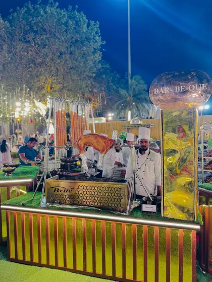 A full view of a barbecue station with a whole roasted animal, demonstrating our capacity for large-scale, impressive culinary displays.