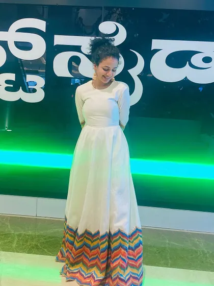A candid moment of joy, perfectly complemented by our comfortable and chic designer dress.