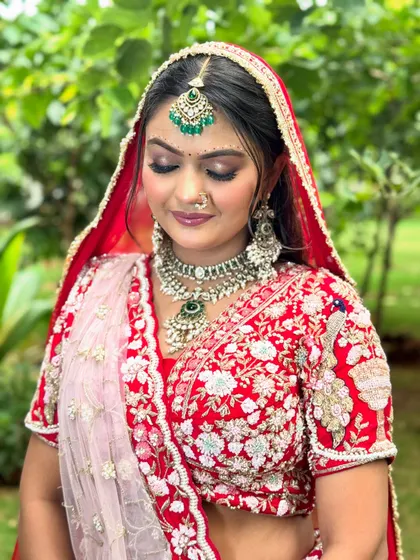 A close up on the soft, shimmering eye makeup and perfectly blended skin for this bride in red. My technique ensures the makeup looks beautiful both up close and from a distance.