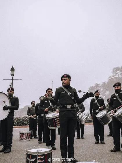 The military band sets the rhythm for the entire parade. I captured the band master leading his section, with the drums and bagpipes creating a powerful visual and auditory experience on a misty morning at India Gate.