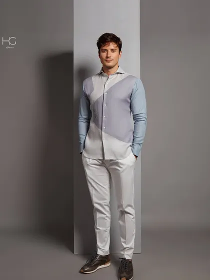 A full-length view of the color-blocked shirt paired with clean white trousers. This outfit is a perfect example of my approach to creating elegant, contemporary menswear.