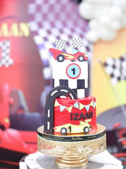 A custom-made cake designed to look like a race track for the Ferrari-themed party.