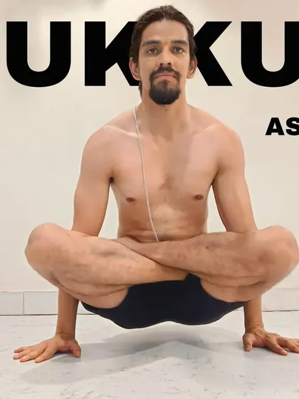 Kukkutasana, or Rooster Pose, is a difficult arm balance that requires great strength. With the legs in lotus, you lift the entire body on your hands, resembling a cock.