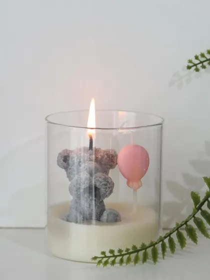 This grey teddy bear candle is another charming option from our baby announcement collection. We offer bulk orders and customization to ensure every detail aligns with your theme.